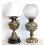 Two Victorian embossed brass oil lamps. Condition reports are not available for Interiors Sale