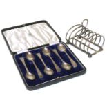 A boxed set of six silver tea spoons by Barker Brother's, Chester and a silver 6-section toast