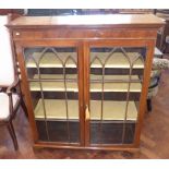Early 20th century mahogany two door display cabinet on bracket feet, 103cm wide. Condition