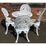 Cast alloy pierced and decorated circular garden table and four chairs Condition reports are not