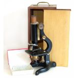 Watson & Sons microscope in case complete with twelve 12 glass slides. Condition reports are not