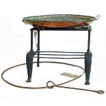 An oval copper warming dish 48 x 39cm, cast footman and large iron ring Condition reports are not