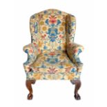 Late 18th century design wing-back upholstered chair.