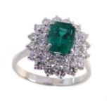 Emerald and diamond 3-tier oval cluster platinum ring.