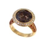 A smoky quartz diamond and topaz dress ring,