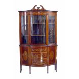 Late 19th century serpentine front, glazed display cabinet by Edwards & Roberts.