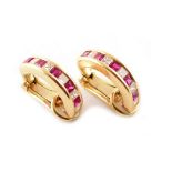 A pair of ruby and diamond set 18ct yellow gold half hoop clip earrings.
