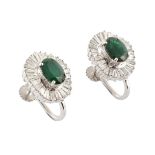 A pair of emerald and diamond oval cluster, white gold, screw back earrings.