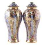 Pair of Wedgwood Fairyland lustre lidded vases (damage to rims).