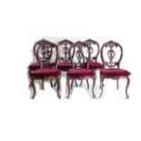 A set of Six Victorian walnut framed single dining chairs.
