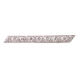 A diamond set platinum bar brooch.