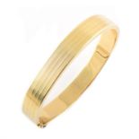 A 14ct yellow gold hinched bangle,