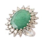 An emerald and diamond fancy oval cluster white gold ring.