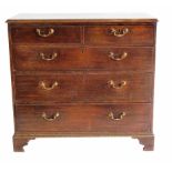 George III oak chest of two short and three long graduated drawers.