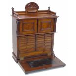 Early 20th century walnut collectors cabinet.