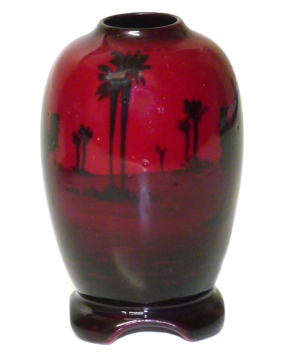 Royal Doulton flambe vase depicting desert scene, 8cm tall. Condition reports are not available