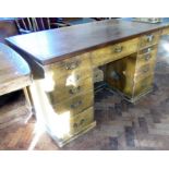 Early 20th century twin-pedestal office desk with pine oak grained bask, four doors to one side