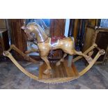 Modern hardwood rocking horse by "Pig & Whittle", 190cm long and 68cm wide. Condition reports are