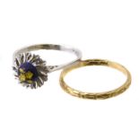 Two dress rings, to include an enamel dress ring and a band ring, both stamped 750, ring sizes N and