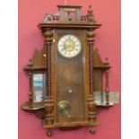 Victorian walnut 8-day wall clock with 1/2 barley twist colums and mirror side shelves Condition