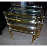 Nest of three brass framed tables. Condition reports are not available for our Interiors Sales