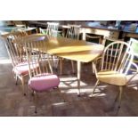 Six Ercol dining chairs (4+2) and extending table. Condition reports are not available for our