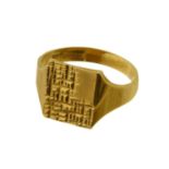 A 9ct gold signet ring, the rectangular shape textured panel with tapered shoulders, hallmarks for