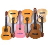 Six nylon strung guitars