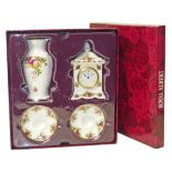Royal Albert "Old Country Roses" clock, vase and candlesticks set in original box. Condition reports