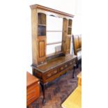 George III style oak and cross-banded dresser with plate rack. Condition reports are not available