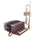 Odyssey trumpet in case and Rosetti piano accordion.