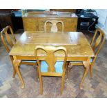 Early 20th century dining room suite complete with draw-leaf table and four chairs and sideboard