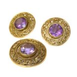 A suite of 9ct gold amethyst jewellery, comprising a pendant and earrings, set with a circular shape