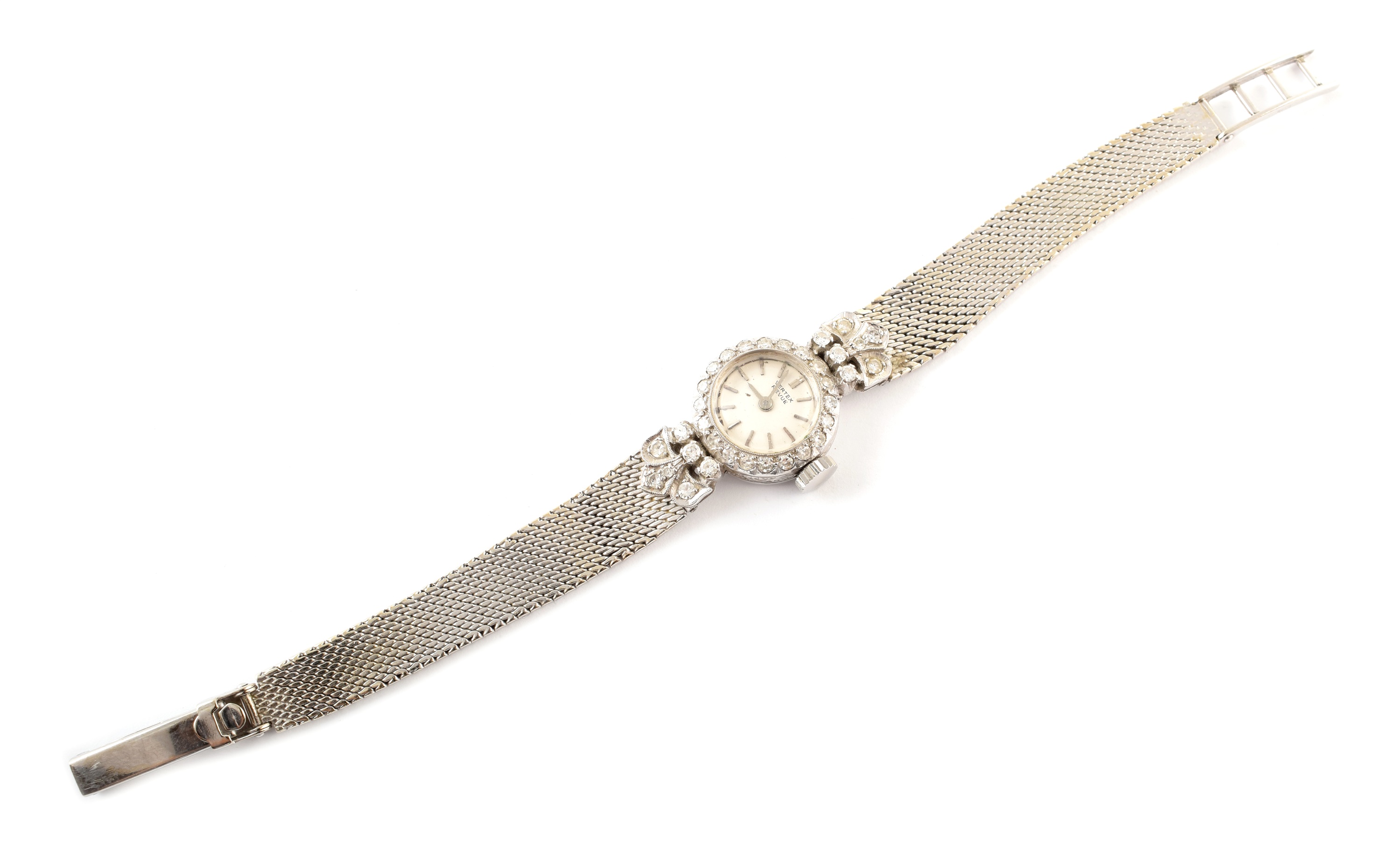 An 18ct white gold and diamond ladies cocktail watch on 9ct white gold strap.