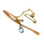 An early 20th century blue paste and split pearl bar brooch, stamped 9ct, gross weight 3g. Condition
