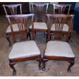 Five George III mahogany splat-back dining chairs on cabriole legs with ball and claw feet.