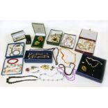 A selection of costume jewellery, to include a Christian Dior foliate brooch and a Swarovski star