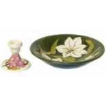 Magnolia on green Moorcroft dish and candlestick. Condition reports are not available for