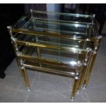 Nest of three brass framed tables. Condition reports are not available for Interiors sales.