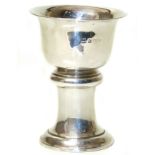 A silver vase, of goblet form, the tapered bowl with fluted rim and columnar stem to the spreading