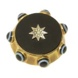 A Victorian onyx and banded agate memorial brooch, of circular outline, the split pearl star inset