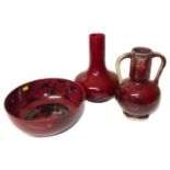 Two Bernard Moore pottery flambe vases and a bowl. Condition reports are not available for Interiors
