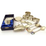 A selection of silver items, to include spirit labels, napkin rings, a compact, a silver purse,