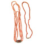 Two coral necklaces to include a triple strand coral necklace with m60arcasite and carnelian push