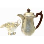 A silver hot water jug, together with a silver cream jug, gross weight 14.23ozt. Condition reports