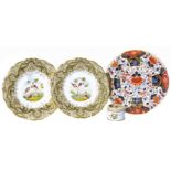 A pair of Graingers Worcester plates painted with birds, also a Derby Imari plate and a Davenport