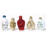 Five Chinese scent bottles in porcelain, glass, simulated ivory and simulated lacquer. Condition