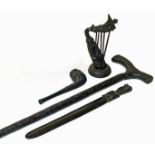 Bog oak walking stick, letter opener, harp and pipe. Condition reports are not available for our