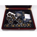 24 assorted 9 carat gold coins in box.