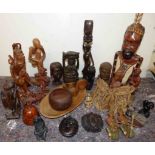 A quantity of mixed African and Asian figures, containers and book ends etc Condition reports not